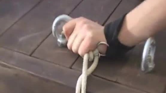Restrained babe gets her shaved pussy whipped and her face fucked